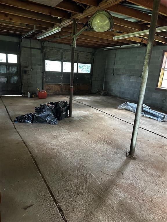 6674 Cowan Mill Rd, Winston, GA 30187 - garage featuring concrete block wall