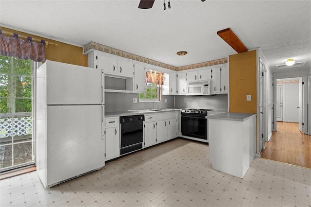 6674 Cowan Mill Rd, Winston, GA 30187 - kitchen with white appliances, light floors, white cabinets, a ceiling fan, and open shelves