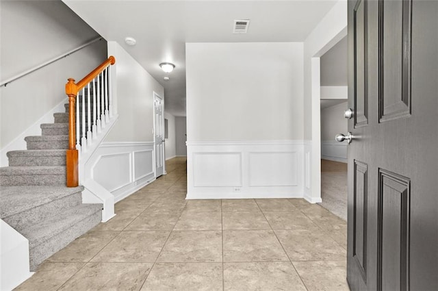 interior space featuring light tile patterned floors