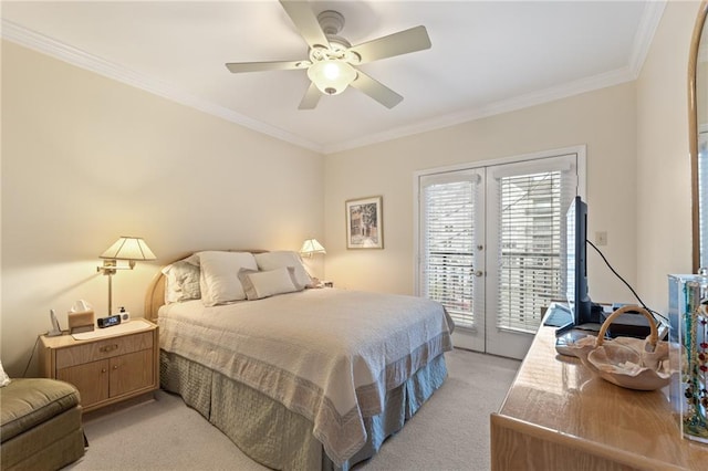 bedroom featuring access to exterior, french doors, light carpet, and crown molding