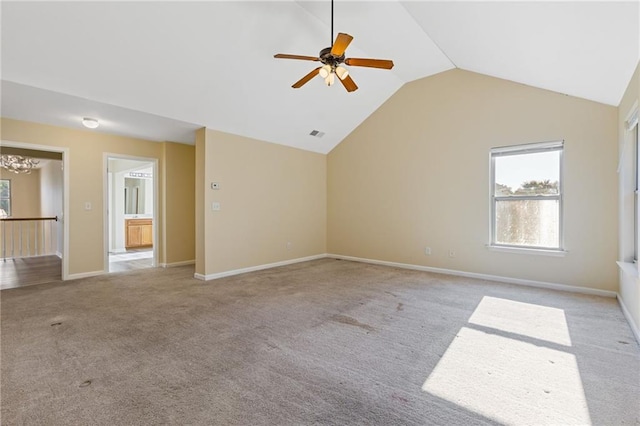 unfurnished living room with light carpet, lofted ceiling, and ceiling fan with notable chandelier