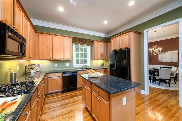 kitchen with black appliances, a chandelier, light wood-style flooring, ornamental molding, and dark stone countertops
