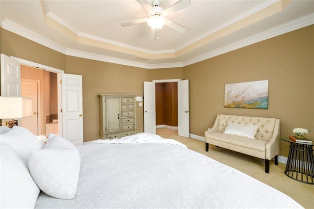 bedroom with a raised ceiling, crown molding, light carpet, baseboards, and a ceiling fan
