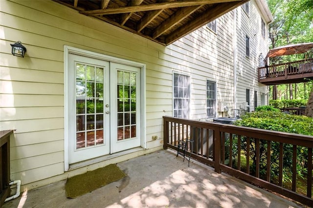 doorway to property with french doors and a wooden deck