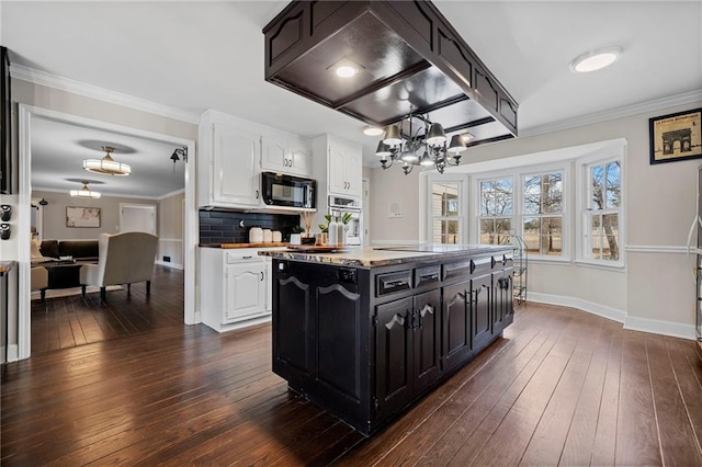 5422 Hill Rd SW, Powder Springs, GA 30127 - kitchen featuring black microwave, a chandelier, dark cabinetry, white cabinets, and ornamental molding