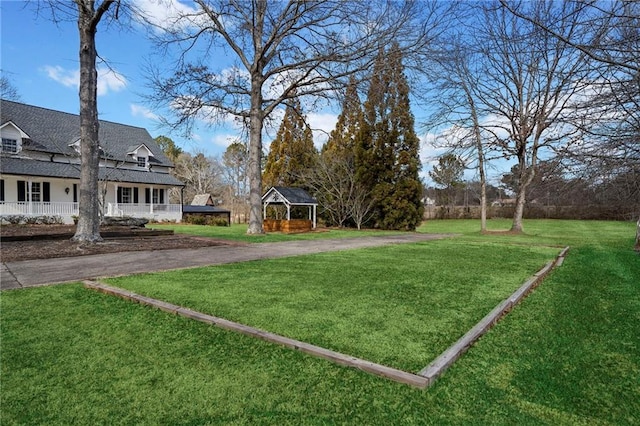 5422 Hill Rd SW, Powder Springs, GA 30127 - view of grassy yard with a gazebo, asphalt driveway, and covered porch