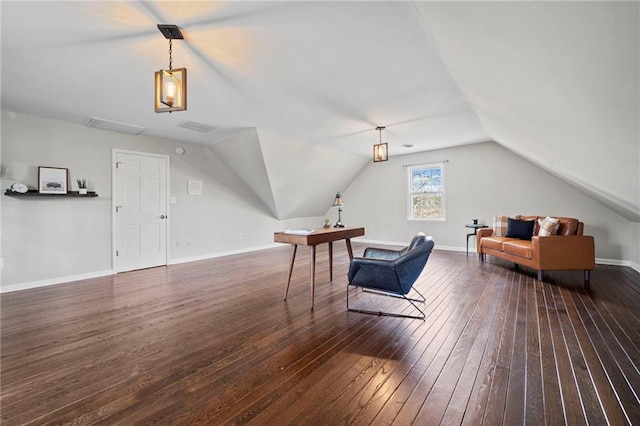 additional living space featuring lofted ceiling and dark hardwood / wood-style flooring