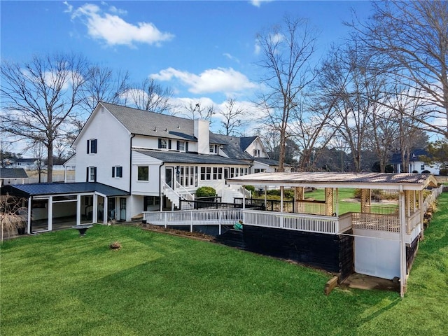 5422 Hill Rd SW, Powder Springs, GA 30127 - rear view of property featuring a sunroom, a lawn, and a shingled roof