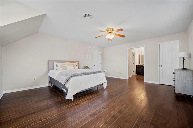 bedroom featuring dark hardwood / wood-style flooring, vaulted ceiling, and ceiling fan