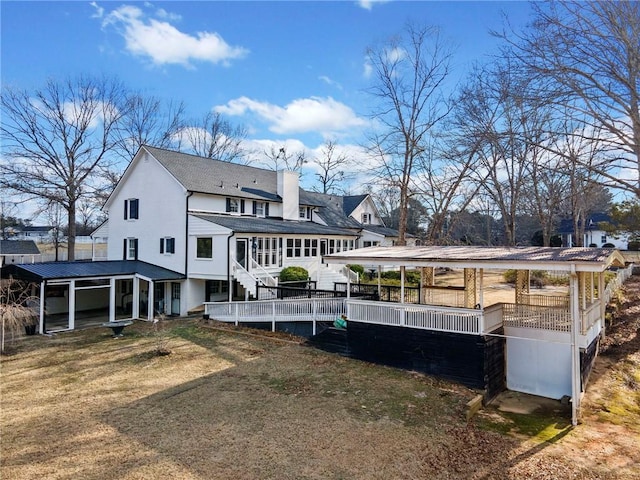 back of property featuring a lawn