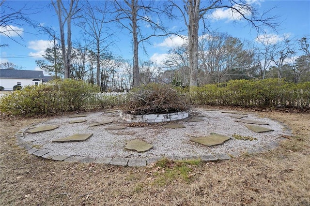 view of yard featuring an outdoor fire pit