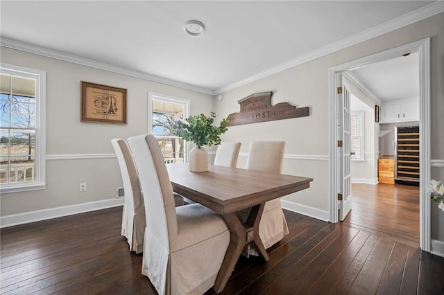 5422 Hill Rd SW, Powder Springs, GA 30127 - dining area with wine cooler, dark wood finished floors, crown molding, and baseboards