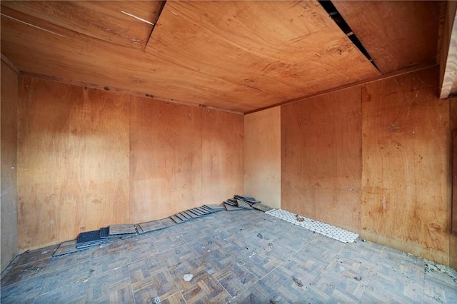 empty room featuring wooden ceiling