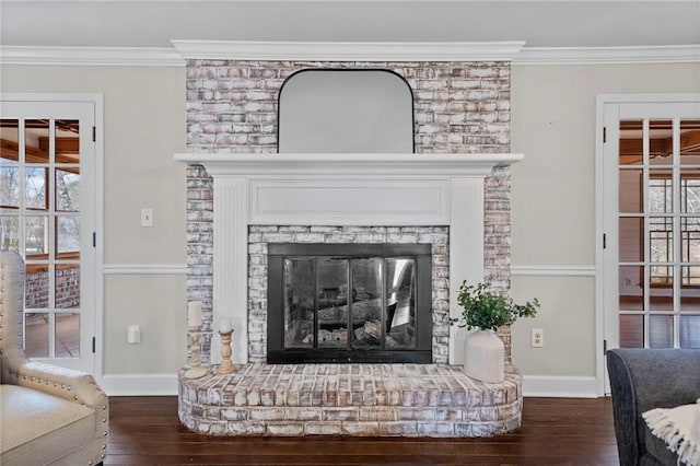 details with crown molding, hardwood / wood-style flooring, and a fireplace