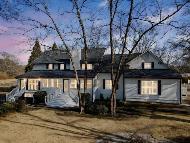 view of front of property with a lawn