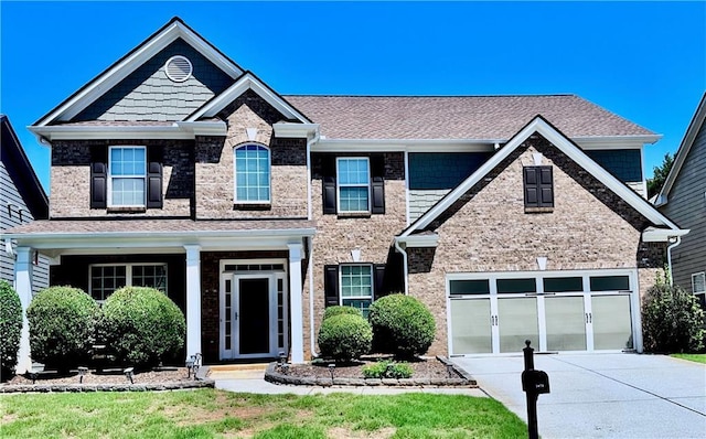 3476 Bridge Walk Dr, Lawrenceville, GA 30044 - view of front of home featuring concrete driveway, a shingled roof, and brick siding