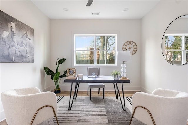 home office featuring recessed lighting, visible vents, baseboards, and wood finished floors