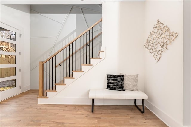 stairs featuring baseboards and wood finished floors