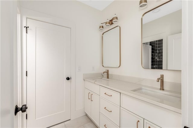 bathroom with tile patterned flooring, double vanity, and a sink