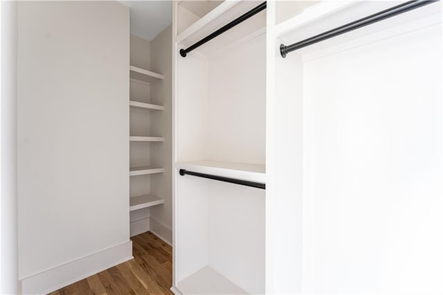 spacious closet with wood finished floors