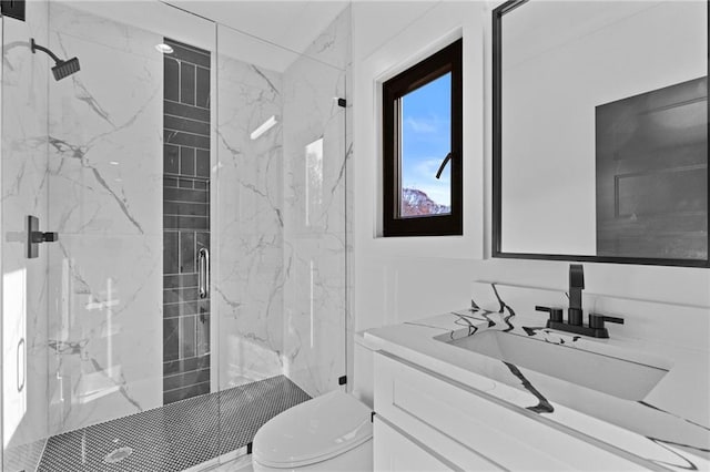 bathroom with vanity, toilet, and an enclosed shower