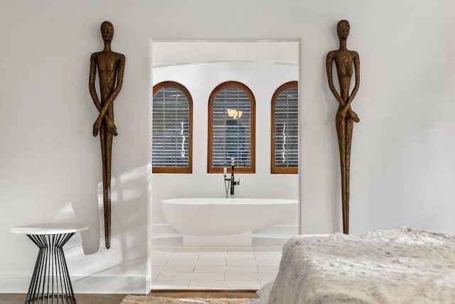 bathroom with a freestanding tub