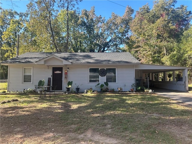 ranch-style home with a carport and a front lawn