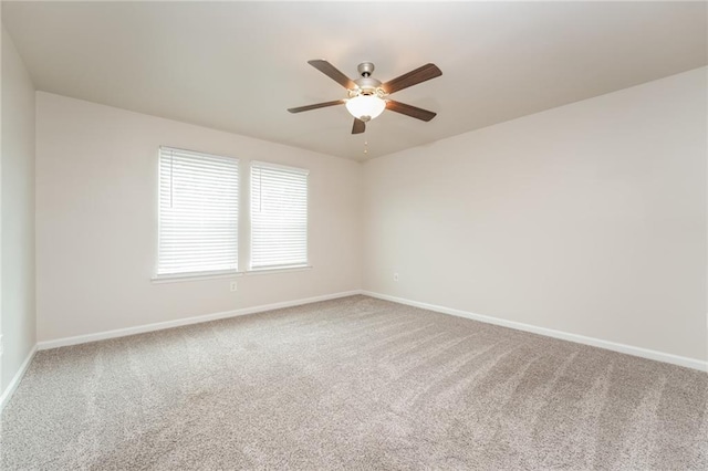 empty room with carpet floors and ceiling fan