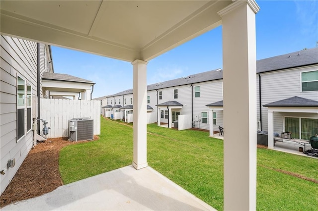 view of yard with a patio and central AC unit