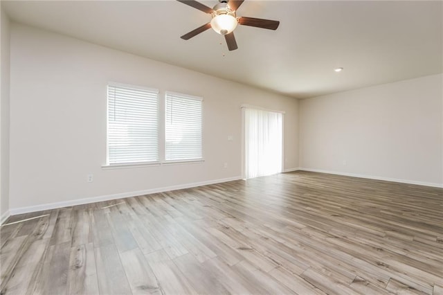 empty room featuring light hardwood / wood-style floors and ceiling fan