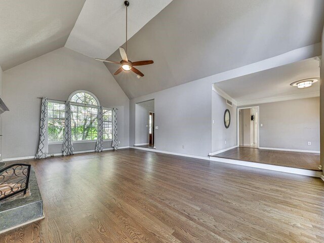 unfurnished living room featuring wood-type flooring, high vaulted ceiling, and ceiling fan