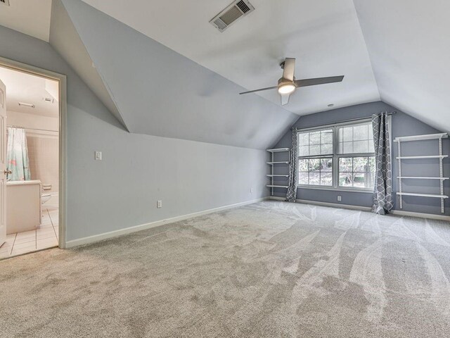 bonus room with carpet, ceiling fan, and vaulted ceiling