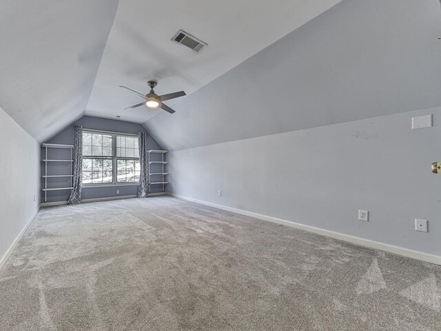 bonus room featuring ceiling fan, carpet floors, and vaulted ceiling