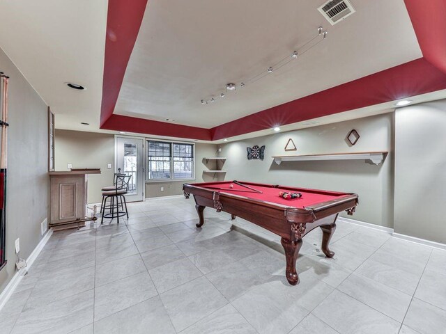 playroom with billiards and a tray ceiling