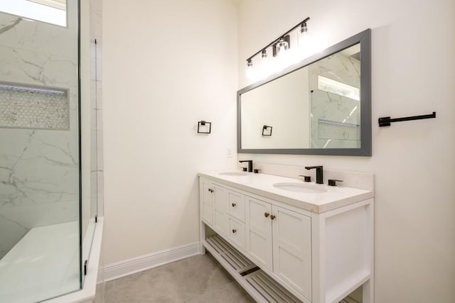 bathroom featuring vanity and a tile shower