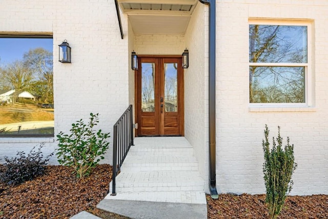 property entrance featuring french doors