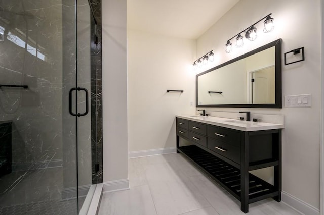 bathroom featuring vanity and a shower with door