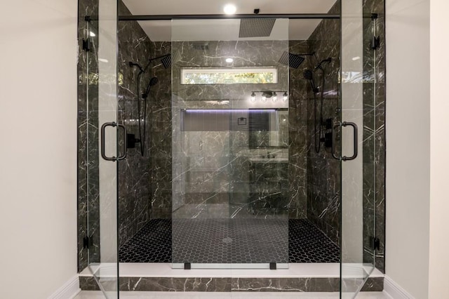 bathroom with a shower with shower door