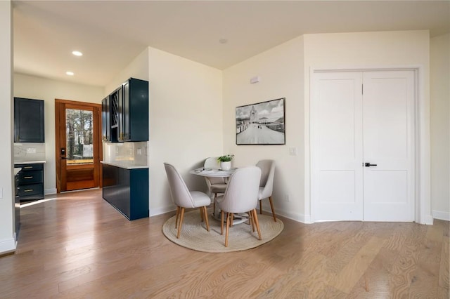 dining room with light hardwood / wood-style flooring