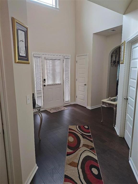 foyer entrance with dark hardwood / wood-style floors