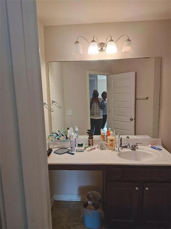 bathroom with tile patterned floors and vanity