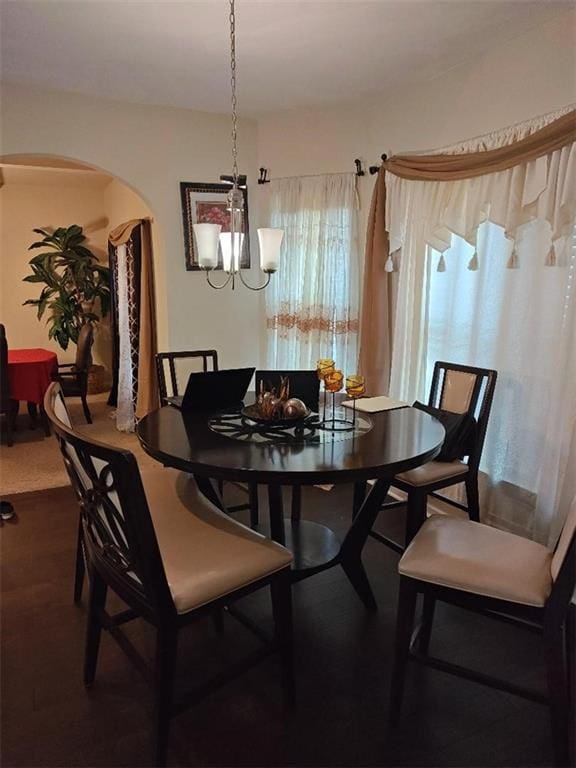 dining area featuring a notable chandelier