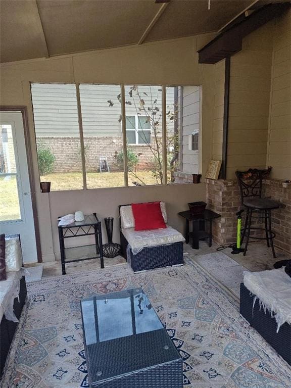 sunroom / solarium with lofted ceiling