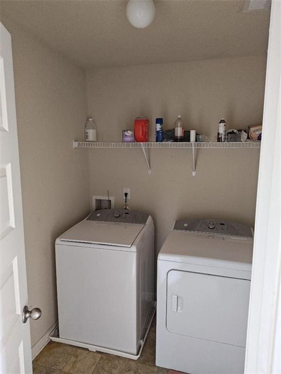 washroom featuring washing machine and dryer