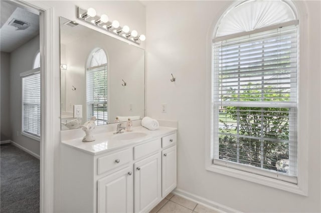 bathroom with tile patterned floors and vanity