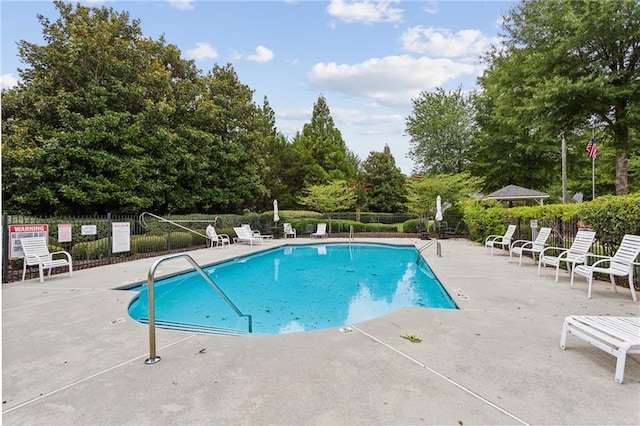 view of swimming pool featuring a patio