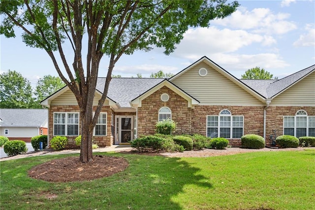 ranch-style home with a front yard