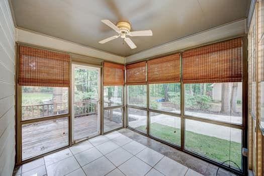 2105 Huntington Hills Trce, Buford, GA 30519 - unfurnished sunroom with ceiling fan