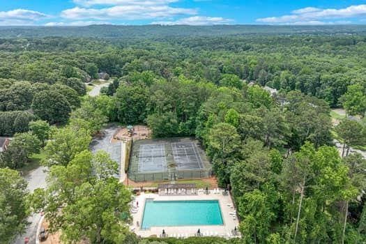 2105 Huntington Hills Trce, Buford, GA 30519 - aerial overview of property's location featuring a heavily wooded area