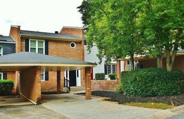 6500 Gaines Ferry Rd Unit A2, Flowery Branch, GA 30542 - view of front facade featuring brick siding and concrete driveway